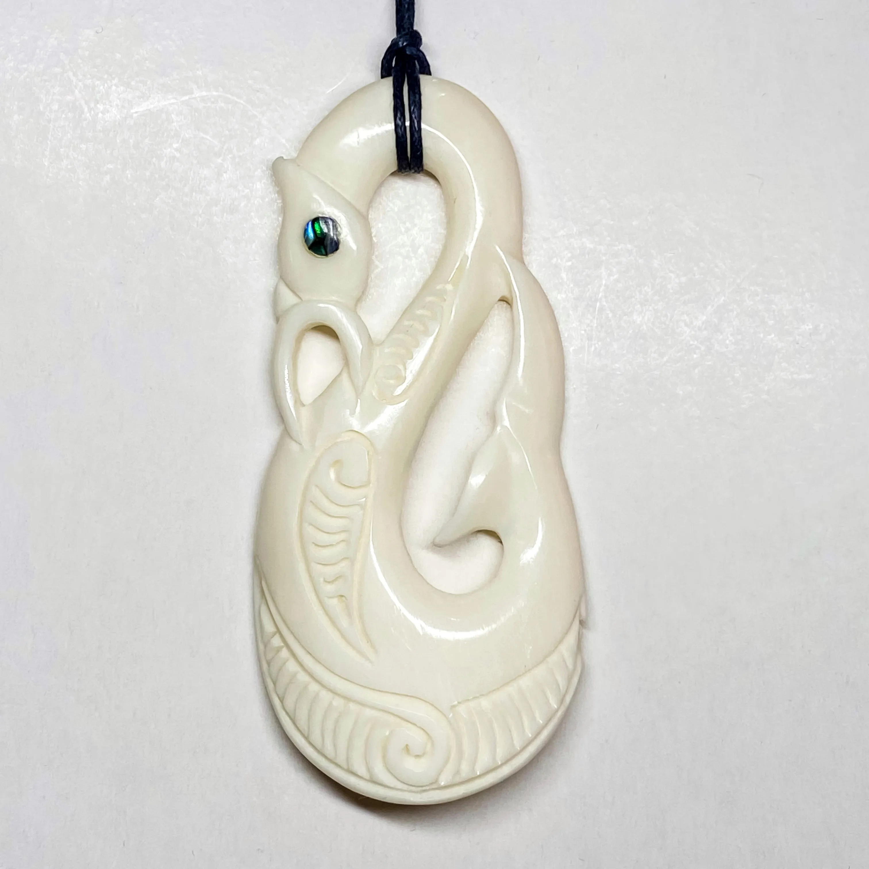 Handcarved Bone Carving Pendant w Paua Eye - Manaia